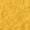 A close-up of a pile of yellow curry powder.