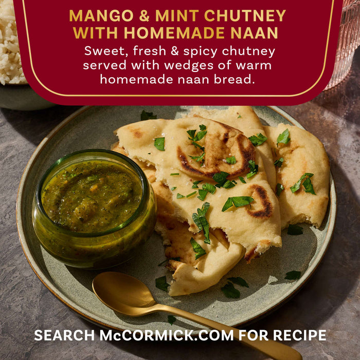 A plate of McCormick's Mango &amp; Mint Chutney with Homemade Naan is shown, featuring a sweet, fresh, and spicy chutney served with wedges of warm homemade naan bread.
