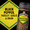 A bottle of McCormick Grill Mates Brazilian Steakhouse seasoning is shown next to a yellow sign that lists black pepper, parsley, garlic, and onion.
