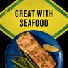 A plate of salmon with asparagus and a lemon wedge is shown with the text Great with Seafood above it.