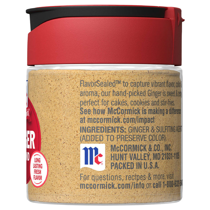 A glass jar of McCormick Ground Ginger with a red lid.