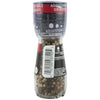 A McCormick &amp; Co. adjustable grinder filled with black and white peppercorns.