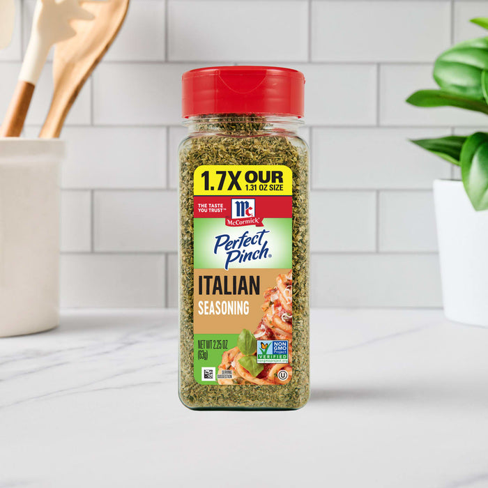 A bottle of McCormick Perfect Pinch Italian Seasoning sits on a kitchen counter.