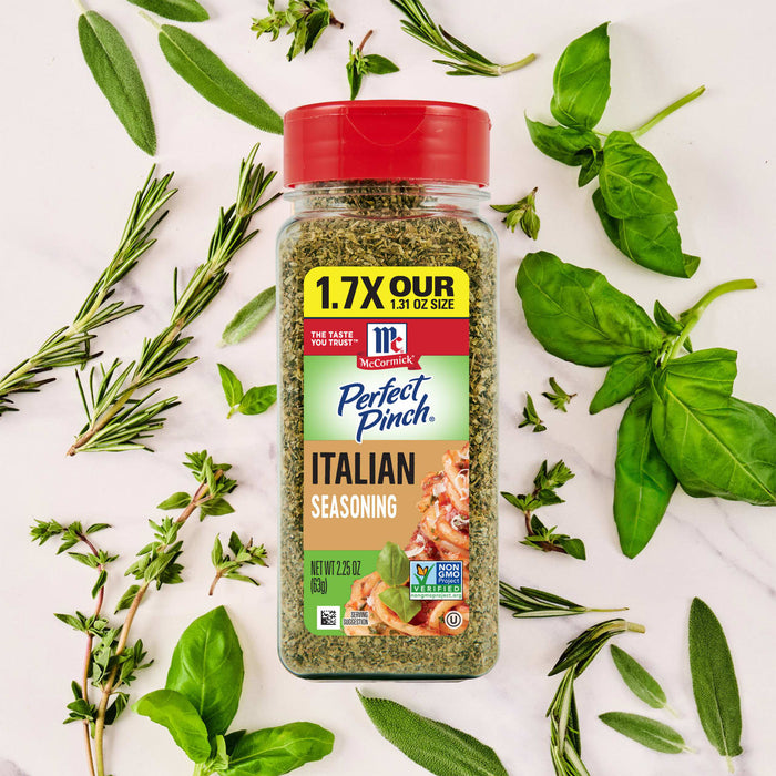 A bottle of McCormick Perfect Pinch Italian Seasoning is surrounded by fresh herbs.