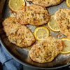 A pan of lemon chicken breasts, showcasing a simple and flavorful meal.