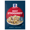 A blue and red packet of Mccormick Regular Beef Stroganoff Sauce Mix Envelope 1.5 Oz featuring a serving suggestion of creamy beef and noodles that can be prepared in 20 minutes.