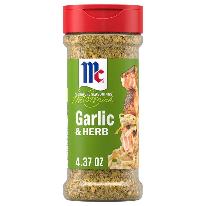 A clear plastic bottle of Mccormick Garlic And Herb Pepper Seasoning Ground 4.37 Oz featuring a green label with a picture of seasoned salmon and pasta.