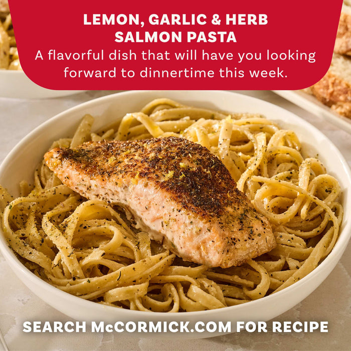 A bowl of lemon garlic and herb salmon pasta seasoned with Mccormick Garlic And Herb Pepper Seasoning Ground 4.37 Oz as part of a flavorful dinner recipe.