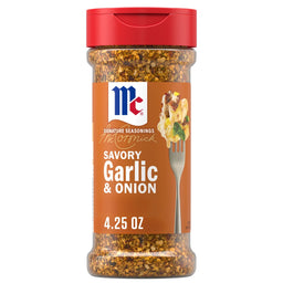 A bottle of Mccormick Signature Seasoning Savory Garlic Onion Oz features a blend of coarse spices and a graphic of cheesy potatoes on a fork.