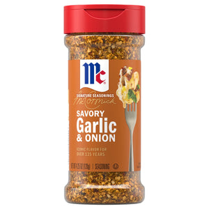 A clear bottle with a red cap displays the label for Mccormick Garlic Onion Pepper Seasoning Ground 4.25 Oz, with the coarse seasoning blend visible through the plastic.