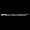 The ingredients list for Mccormick Garlic Onion Pepper Seasoning Ground 4.25 Oz is shown in white text on a black background, listing sea salt, garlic, mustard bran, onion, black pepper, lemon peel, chili pepper, oregano, and parsley.