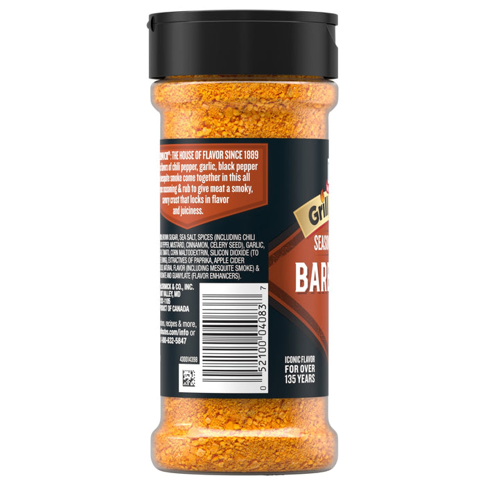 A clear plastic bottle of Mccormick Grill Mates Barbecue Seasoning Rub 6 Oz shows the orange spice blend and a label listing ingredients like brown sugar and chili pepper.