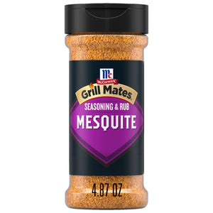 A bottle of Mccormick Grill Mates Mesquite Seasoning Rub 4.87 Oz features a bold purple label and a black cap over the coarse spice blend.