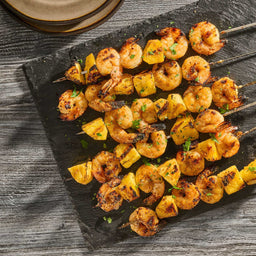Grilled shrimp and pineapple skewers, a delicious and healthy appetizer.