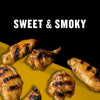 A close-up of grilled chicken wings with a sweet and smoky flavor.
