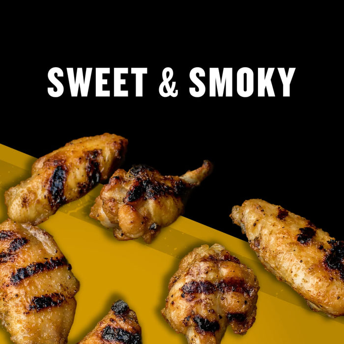 A close-up of grilled chicken wings with a sweet and smoky flavor.