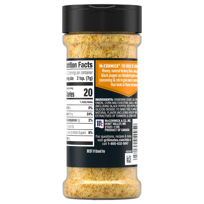 A clear plastic bottle of Mccormick Grill Mates Honey Hickory Seasoning Rub 5.75 Oz shows the nutrition facts and ingredient list including demerara sugar, salt, and natural hickory smoke flavor.