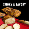 A close-up of grilled chicken with the text Smoky &amp; Savory.
