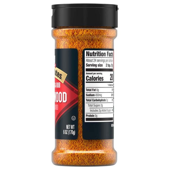 A side view of a bottle of Mccormick Grill Mates Applewood Seasoning Rub 6 Oz showing the nutrition facts label and the orange-brown spice blend inside.