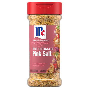 A clear shaker bottle of Mccormick Himalayan Pink Salt Pepper And Garlic Seasoning Ground 6.5 Oz is shown against a white background, highlighting the coarse texture of the seasoning blend inside.
