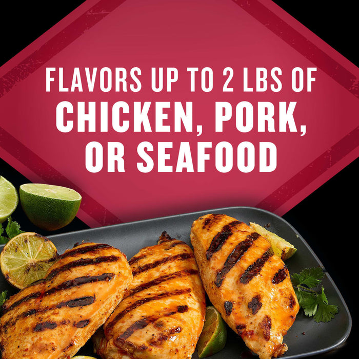 This product flavors up to 2 lbs of chicken, pork, or seafood, as shown in the image of grilled chicken breasts with lime.