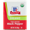 A McCormick brand tin of organic pure ground black pepper.