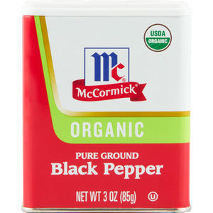 A McCormick brand tin of organic pure ground black pepper.