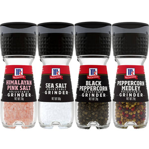 Four McCormick spice grinders Himalayan pink salt sea salt black peppercorn and peppercorn medley.