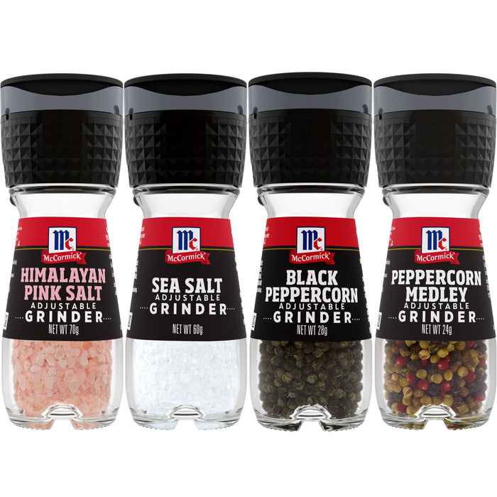 Four McCormick spice grinders Himalayan pink salt sea salt black peppercorn and peppercorn medley.