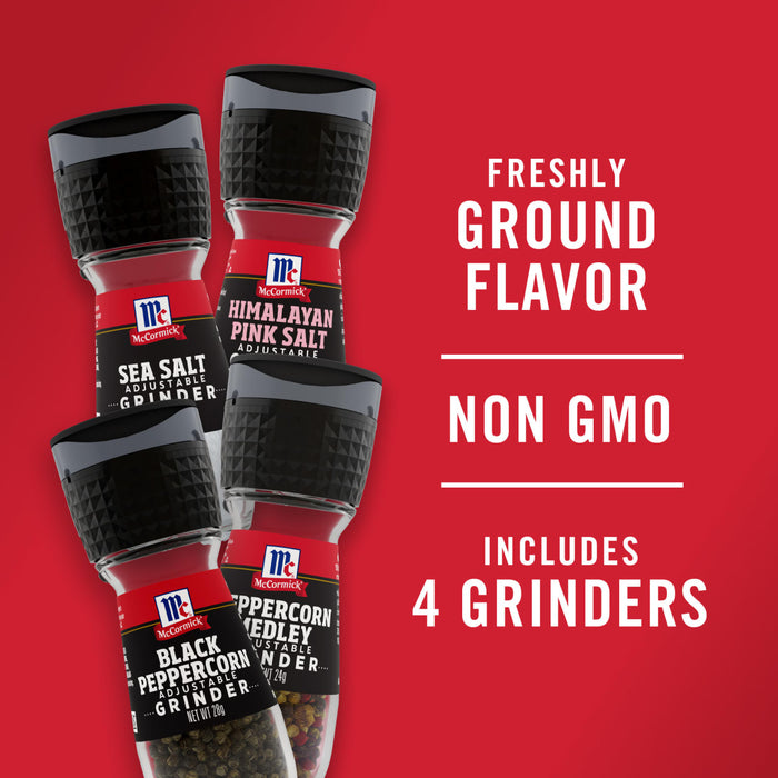 Four McCormick grinders with different spices including Himalayan pink salt sea salt black peppercorn and peppercorn medley.