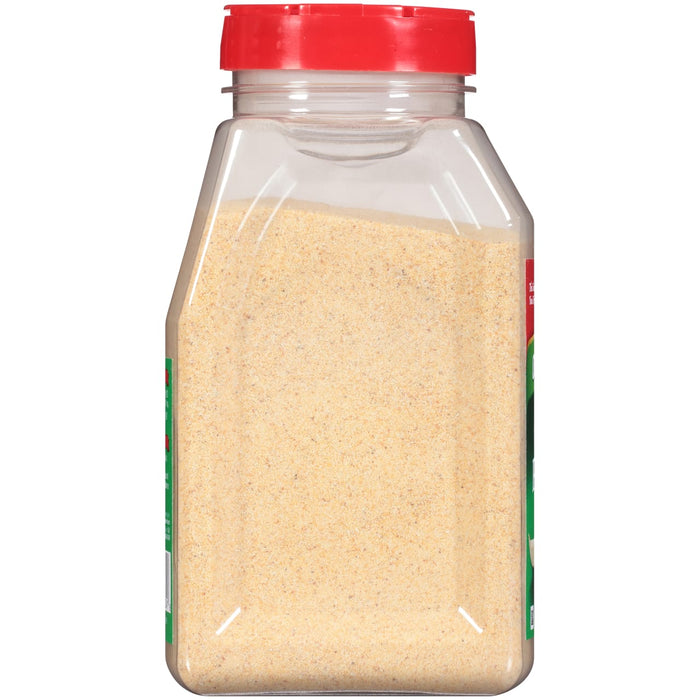 A clear plastic jar with a red lid filled with granulated garlic.