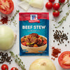 McCormick Beef Stew seasoning mix packet with ingredients like tomatoes onions thyme and peppercorns.