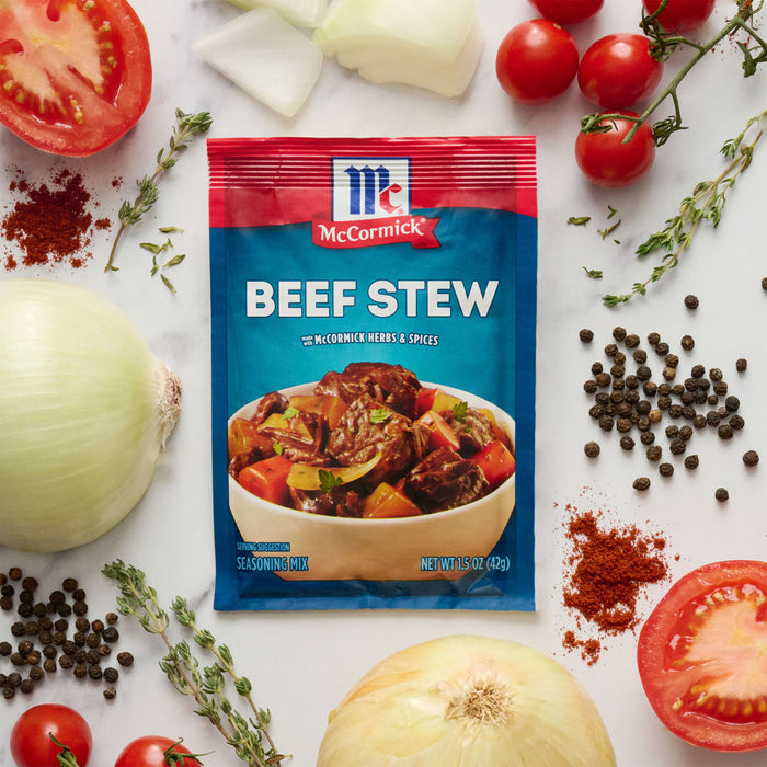 McCormick Beef Stew seasoning mix packet with ingredients like tomatoes onions thyme and peppercorns.