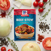 McCormick Beef Stew seasoning mix packet with ingredients like tomatoes onions thyme and peppercorns.