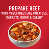 A bowl of beef stew with potatoes carrots onion and celery.