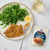 A plate with McCormick Shake n Bake Parmesan crusted chicken, a side salad, and a glass of white wine.