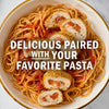 A plate of pasta with tomato sauce and sliced stuffed chicken, suggesting a delicious pairing.