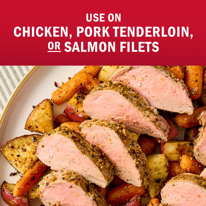 A seasoned pork tenderloin is sliced and served with roasted vegetables, suggesting it can also be used on chicken or salmon.