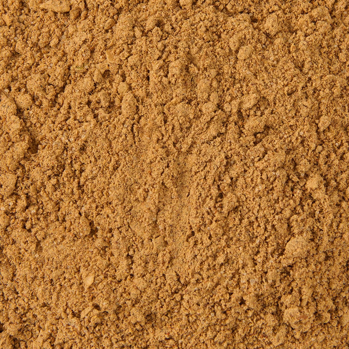 A close-up of finely ground, light brown powder.