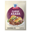 A packet of McCormick Carne Asada Seasoning Mix is displayed, featuring a photo of carne asada tacos.