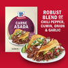McCormick Carne Asada seasoning packet and prepared tacos, highlighting the robust blend of chili pepper, cumin, onion, and garlic.