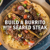 A burrito with seared steak is shown, highlighting the ingredients and the build-your-own concept.