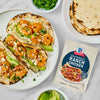 A plate of shrimp tacos with avocado and McCormick Ranch Chicken seasoning packet displayed.