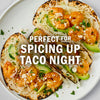 These shrimp tacos with avocado and cheese are perfect for spicing up taco night.