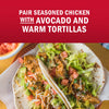 A delicious taco featuring seasoned chicken, avocado, and warm tortillas.
