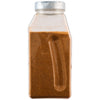 A large, clear plastic container of Mccormick Culinary Peruvian Seasoning Powder 24 Oz is shown against a white background.