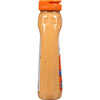 ["A side view of a bottle of Hellmann's Spicy Sriracha Mayo."]