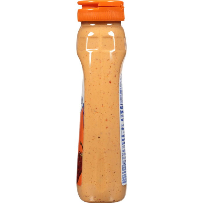 ['A bottle of Kraft Spicy Ranch Dressing.']
