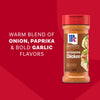 A bottle of Mccormick Perfect Pinch Rotisserie Chicken Seasoning Powder 5 Oz is displayed against a red background featuring text that highlights its warm blend of onion, paprika, and bold garlic flavors.