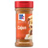 A bottle of Mccormick Perfect Pinch Cajun Seasoning Ground 5 Oz featuring a red flip-top lid and a vibrant orange label with an image of seasoned chicken over rice.